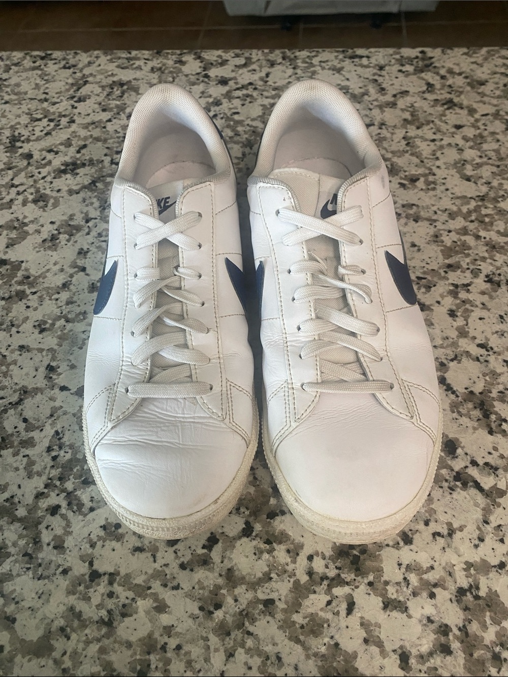 Nike Men’s White Leather Sneakers with Navy Swoosh Accent